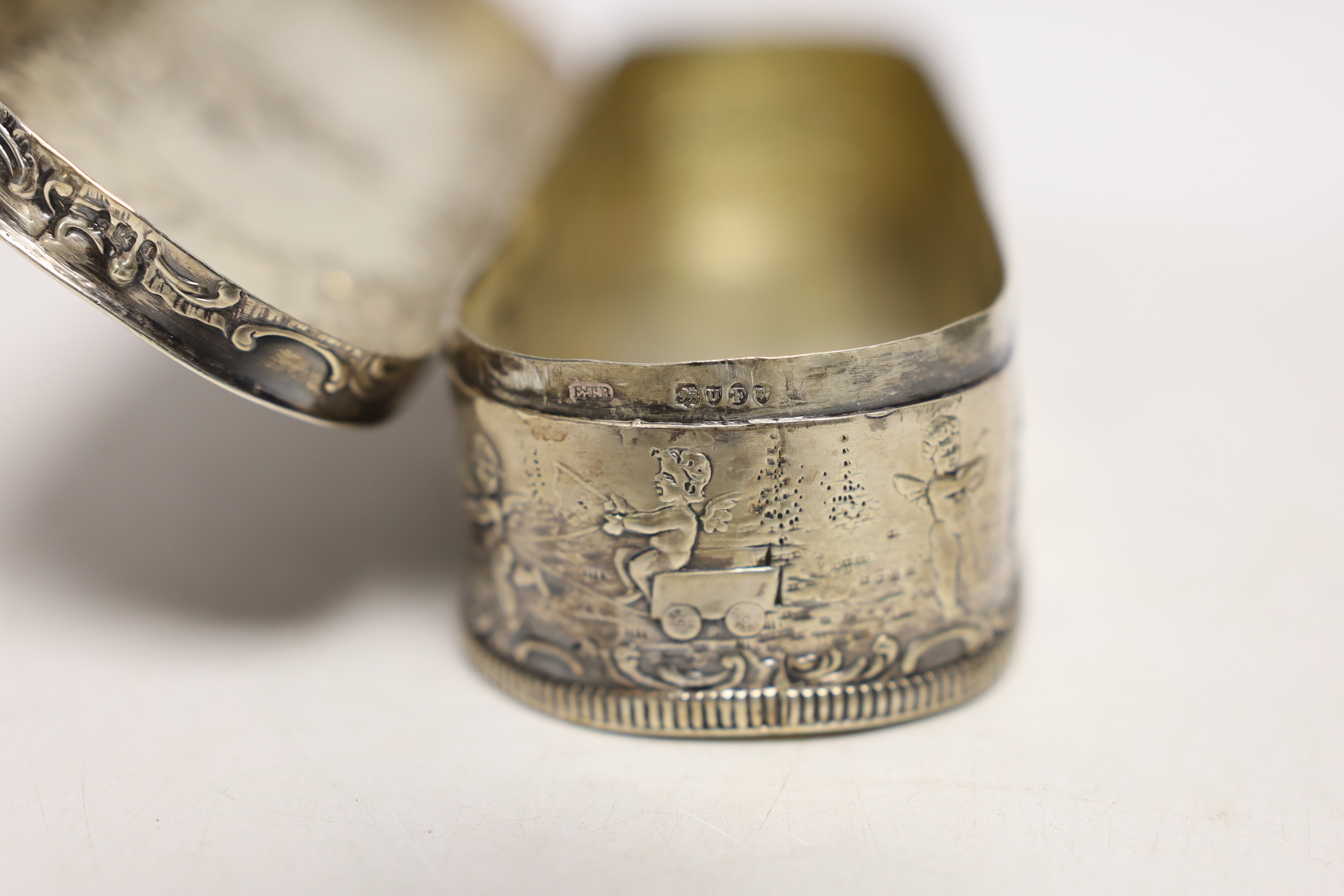 A late 19th/early 20th century Hanau repousse white metal oval box, with hinged cover, 18cm, 7.2oz.